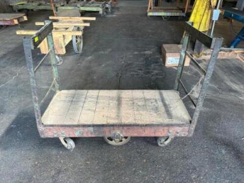 DESCRIPTION: 60" HEAVY DUTY WAREHOUSE CART W/ HAND RAIL ADDITIONAL INFORMATION W/ HEAVY DUTY CAST IRON WHEELS LOCATION: WAREHOUSE QTY: 1