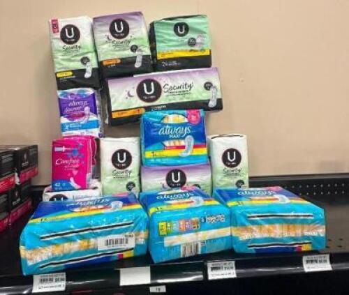 (12) ASSORTED PACKS OF FEMININE HYGIENE PRODUCTS.