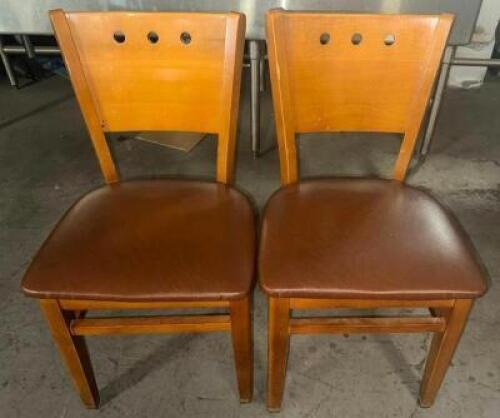 (12) HARDWOOD CHAIRS W/ TAN CUSHIONS SEATS.