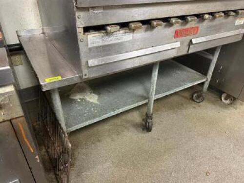 60" LOW BOY STAINLESS EQUIPMENT STAND W/ 2" BACK AND SIDE SPLASH. ON CASTERS.