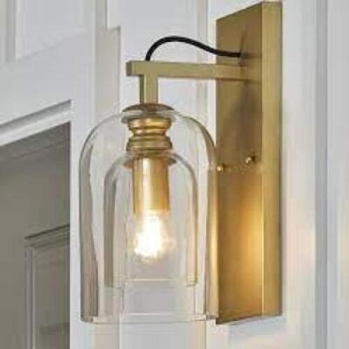 DESCRIPTION: (1) BHG GOLD INDOOR WALL SCONCE WITH CLEAR GLASS SHADE BRAND/MODEL: BETTER HOME AND GARDEN RETAIL$: $60.00 EA QTY: 1