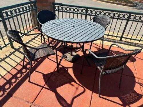 48" ROUND PATIO TABLE W/ (4) METAL AND WICKER CHAIRS.