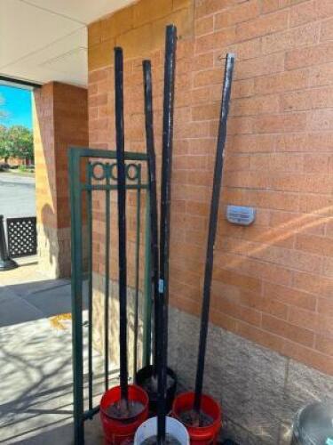 (4) PATIO STRING LIGHT POLES W/ BUCKET AND CONCRETE BASES.