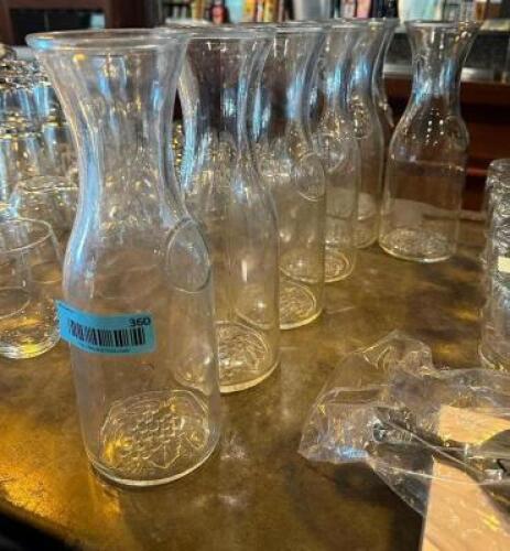 (7) LARGE GLASS CARAFES.