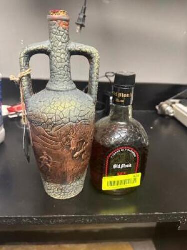 (2) BOTTLES ( OPEN ) OF SPIRITS.