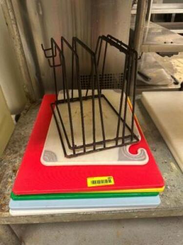 (4) PLASTIC CUTTING BOARDS W/ WIRE STAND.