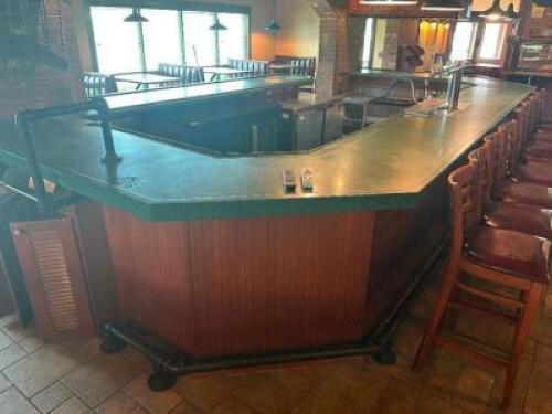 DESCRIPTION: 20' X 9' OVAL SHAPED BAR W/ GREEN MELAMINE TOP, 3" METAL FOOT RAIL, WOODEN PANELING, AND (2) CEILING MOUNTED GLASS RACKS. ADDITIONAL INFO