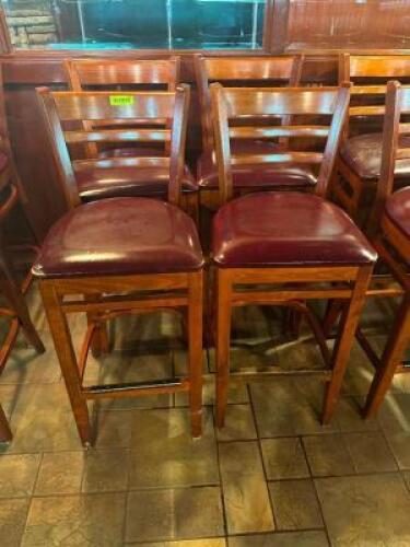 DESCRIPTION: (4) 30" LADDER BACK WOODEN BAR STOOLS W/ MAROON PADDED SEATS LOCATION: BAR THIS LOT IS: SOLD BY THE PIECE QTY: 4