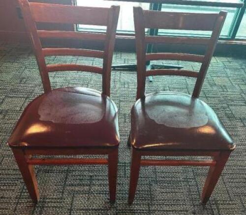 DESCRIPTION: (10) LADDER BACK CHAIRS W/ MAROON PADDED SEATS. ADDITIONAL INFORMATION FRAMES IN GOOD SHAPE, CUSHIONS NEED REPLACED. MOST HAVE DMG LOCATI