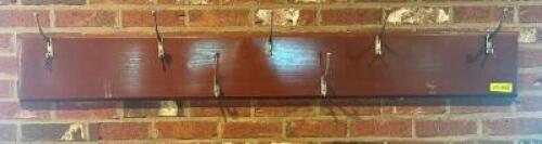DESCRIPTION: SEVEN GROUP WALL MOUNTED COAT RACK W/ HOOKS. LOCATION: ENTRANCE QTY: 1