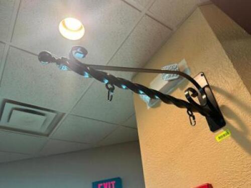 DESCRIPTION: WROUGHT IRON WALL MOUNTED SIGN HOLDER LOCATION: MAIN SEATING QTY: 1
