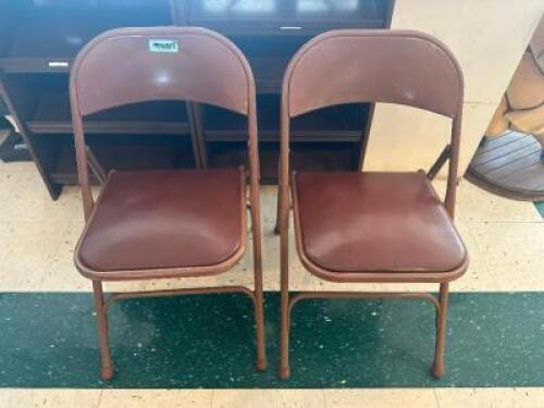 (2) FOLD METAL CHAIRS W/ MAROON CUSHION SEATS.