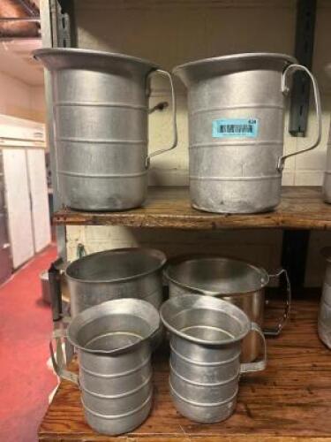 (6) PIECE METAL MEASURING PITCHER SET.