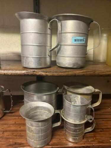 (6) PIECE METAL MEASURING PITCHER SET.
