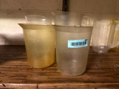 (4) ASSORTED PLASTIC PITCHERS.