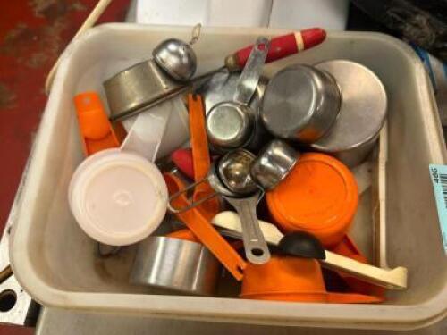 BIN AND CONTENTS - ASSORTED MEASURING CUPS AND SPOONS.