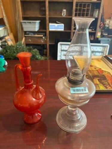 VINTAGE OIL LANTERN AND RED GLASS PITCHER.