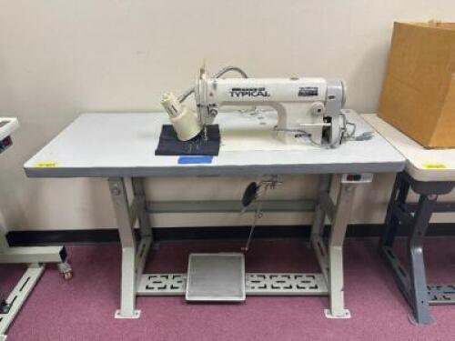 TYPICAL SINGLE NEEDLE BOTTOM FEED SEWING MACHINE WITH TABLE