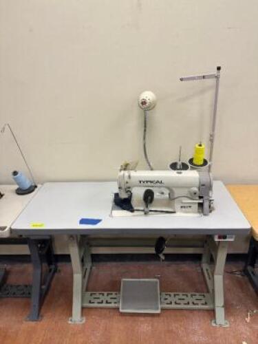 TYPICAL SINGLE NEEDLE BOTTOM FEED SEWING MACHINE WITH TABLE