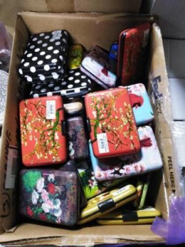 DESCRIPTION: (1) CASE OF APPROX (50) METAL WALLETS BRAND/MODEL: ARMORED WALLET INFORMATION: MANY DESIGNS QTY: 1