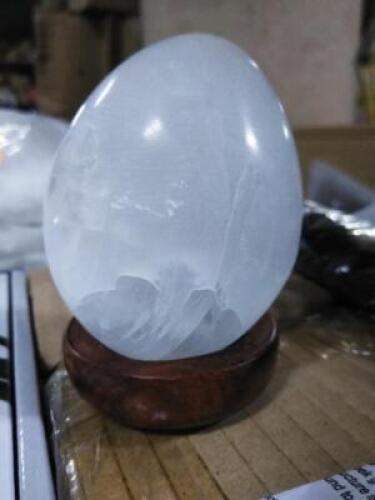 DESCRIPTION: (3) EGG SHAPED SELENITE WITH STAND RETAIL$: $30.00 EA QTY: 3