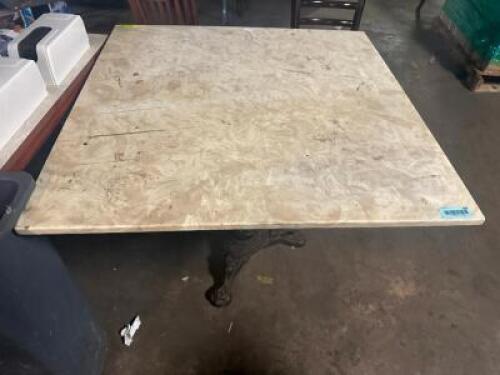 36" X 36" STONE TABLE TOP WITH DECORATIVE CLAW FOOT CAST IRON BASE.
