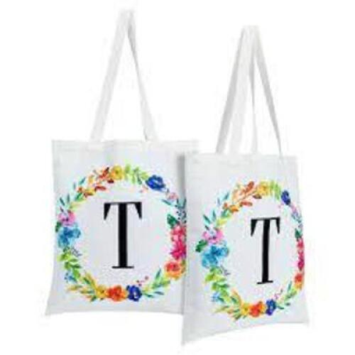 DESCRIPTION: (5) MONOGRAMMED CARRY BAGS BRAND/MODEL: OKUNA OUTPOST INFORMATION: WHITE WITH FLOWERS SIZE: THE LETTER Y RETAIL$: $13.99 EA QTY: 5