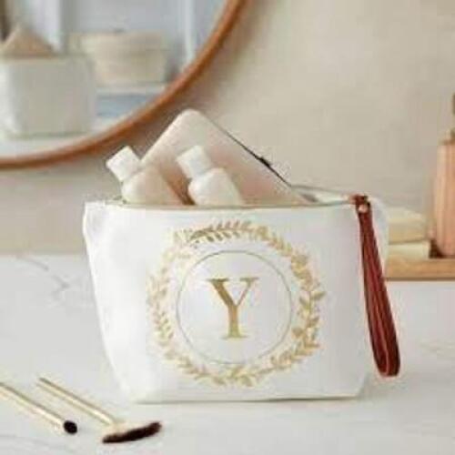 DESCRIPTION: (8) MAKE UP BAGS, WITH WRISTLET BRAND/MODEL: GLAMLILY INFORMATION: WHITE MONOGRAM WITH FOIL SIZE: LETTER "Y" RETAIL$: $9.99 PER BAD QTY: