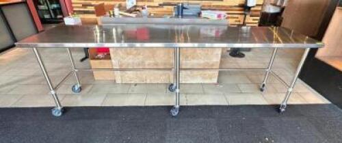NAME: STAINLESS TABLE ON WHEELS DESCRIPTION: STAINLESS TABLE ON WHEELS ADDITIONAL INFORMATION: TABLE ONLY SIZE: 10FTX30" LOCATION: FRONT ENTRANCE QTY: