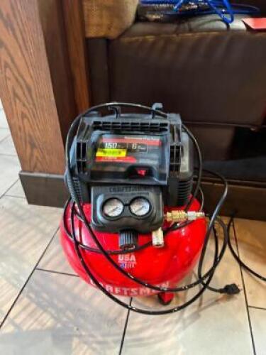 DESCRIPTION: 6 GALLON AIR COMPRESSOR WITH ATTACHMENTS BRAND/MODEL: CRAFTSMAN LOCATION: DINING AREA QTY: 1