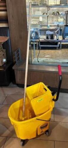 DESCRIPTION: MOP BUCKET WITH MOP LOCATION: DINING AREA QTY: 1