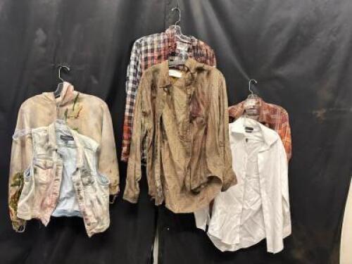 DESCRIPTION (6) ASSORTED ACTORS SHIRTS W/ FAKE BLOOD, DIRT AND GRIME ADDITIONAL INFORMATION EVERY STAIN, EVERY BLEMISH, TELLS A STORY OF HORROR AND DE