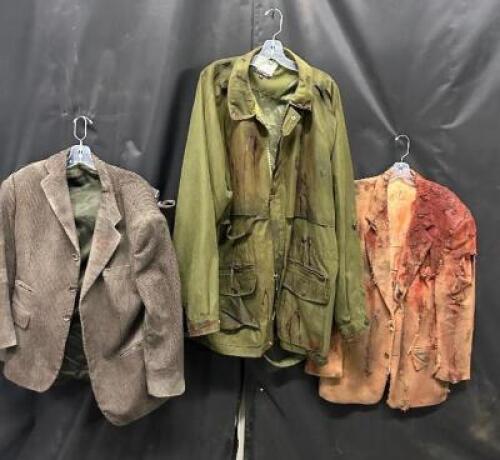 DESCRIPTION (4) ASSORTED ACTORS JACKETS W/ FAKE BLOOD, DIRT AND GRIME ADDITIONAL INFORMATION EVERY STAIN, EVERY BLEMISH, TELLS A STORY OF HORROR AND D