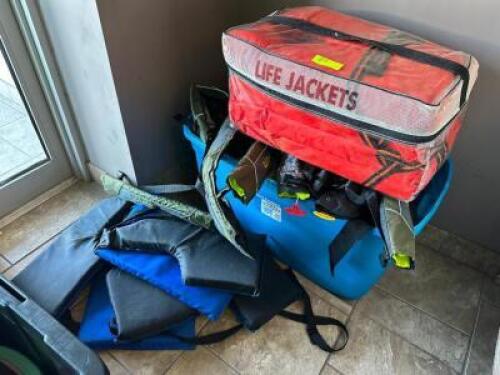 PLASTIC TOTE AND CONTENTS - ASSORTED LIFE JACKETS.