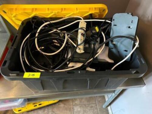 PLASTIC TOTE AND CONTENTS - ASSORTED SURGE STRIPS AND EXTENSION CORDS.