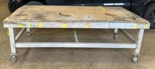 ALUMINUM WORKTABLE WITH WOOD TOP ON CASTERES