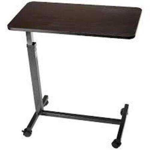 DESCRIPTION: (1) OVERBED TABLE BRAND/MODEL: DYNAREX #10450 INFORMATION: SILVER AND WALNUT RETAIL$: $119.99 EA QTY: 1