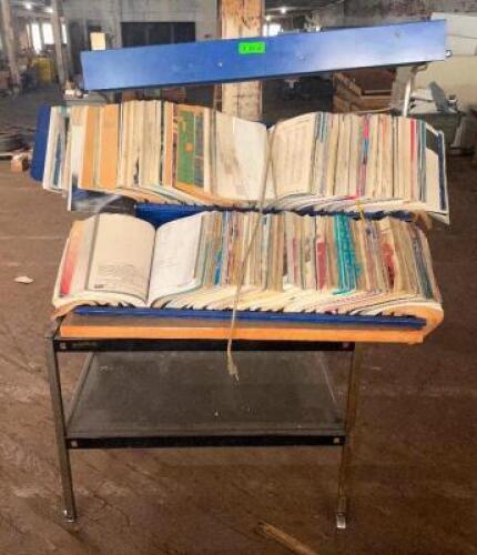 FORD QUALITY PARTS CATALOG WITH ROLLING STAND AND MOUNTED LIGHT