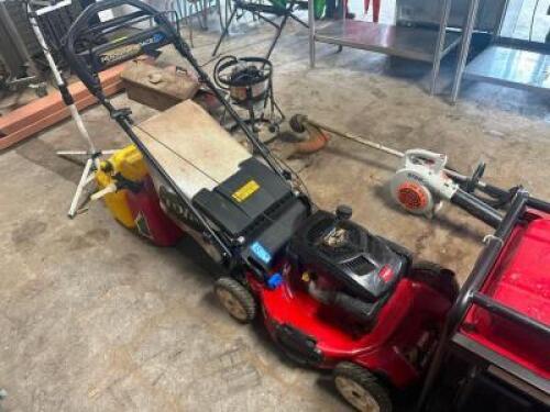 DESCRIPTION TORO PERSONAL PACE WALK BEHIND GAS POWERED LAWN MOWER. BRAND / MODEL: TORO ADDITIONAL INFORMATION W/ (2) FUEL CANS. HAS COMPRESSION LOCATI