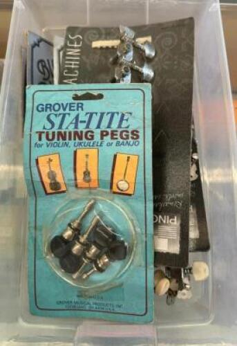 BIN OF GUITAR TUNER PIECES