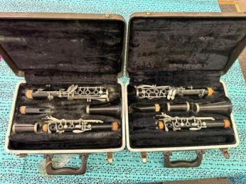 (2)- PLASTIC BUNDY CLARINETS