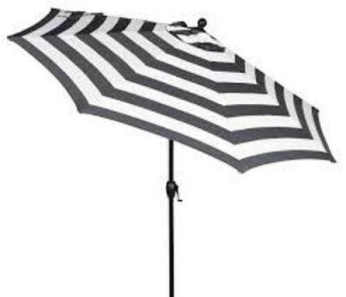 DESCRIPTION: (1) PREMIUM OUTDOOR UMBRELLA BRAND/MODEL: BETTER HOMES AND GARDENS INFORMATION: IBIZA STRIPE - BLACK AND WHITE SIZE: 9' RETAIL$: $236.00