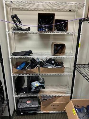 CONTENTS OF SHELF - ASSORTED CABLES AND POWER CORDS.