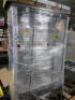 DESCRIPTION: (1) FREESTANDING DISPLAY CASEBRAND/MODEL: GHENT #56TP05INFORMATION: WOODEN WALNUT VINYL, GLASS FRONT IS BROKEN, SEE INSPECTIONSIZE: 80" X 48" X 16"RETAIL$: $3622.90 EAQTY: 1 - 2