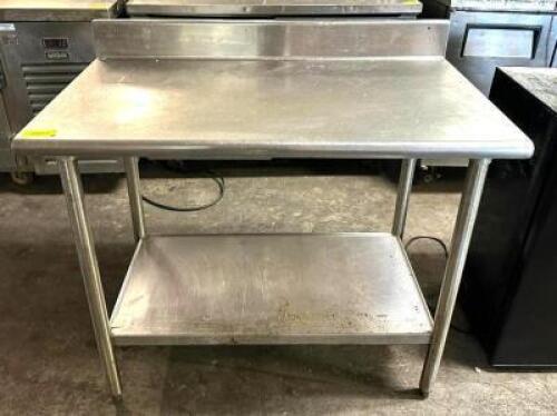 DESCRIPTION: 42" STAINLESS TABLE WITH UNDERSHELF SIZE: 42"X24"X35" QTY: 1