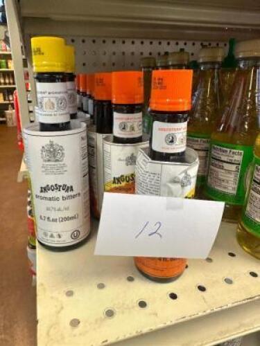 (12) ASSORTED JARS OF BITTERS AND MIXES.