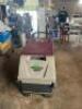 DESCRIPTION: WALK-BEHIND FLOOR SCRUBBER MACHINE BRAND/MODEL: MINUTMAN 200 INFORMATION: NEEDS NEW BATTERY QTY: 1 - 2