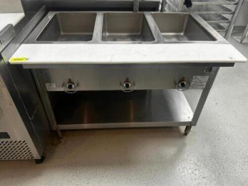 DESCRIPTION DUKE THREE WELL ELECTRIC HOT TABLE. BRAND / MODEL: DUKE E303SW M ADDITIONAL INFORMATION SN# 07218523 LOCATION KITCHEN QTY 1