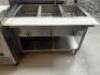 DESCRIPTION DUKE THREE WELL ELECTRIC HOT TABLE. BRAND / MODEL: DUKE E303SW M ADDITIONAL INFORMATION SN# 07218523 LOCATION KITCHEN QTY 1