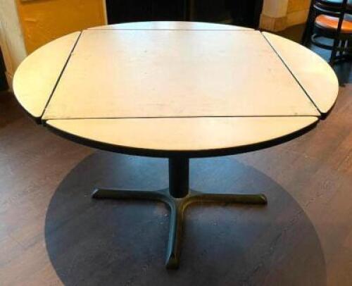 42" ROUND PADDED TOP TABLE W/ DROP LEAF SIDES.